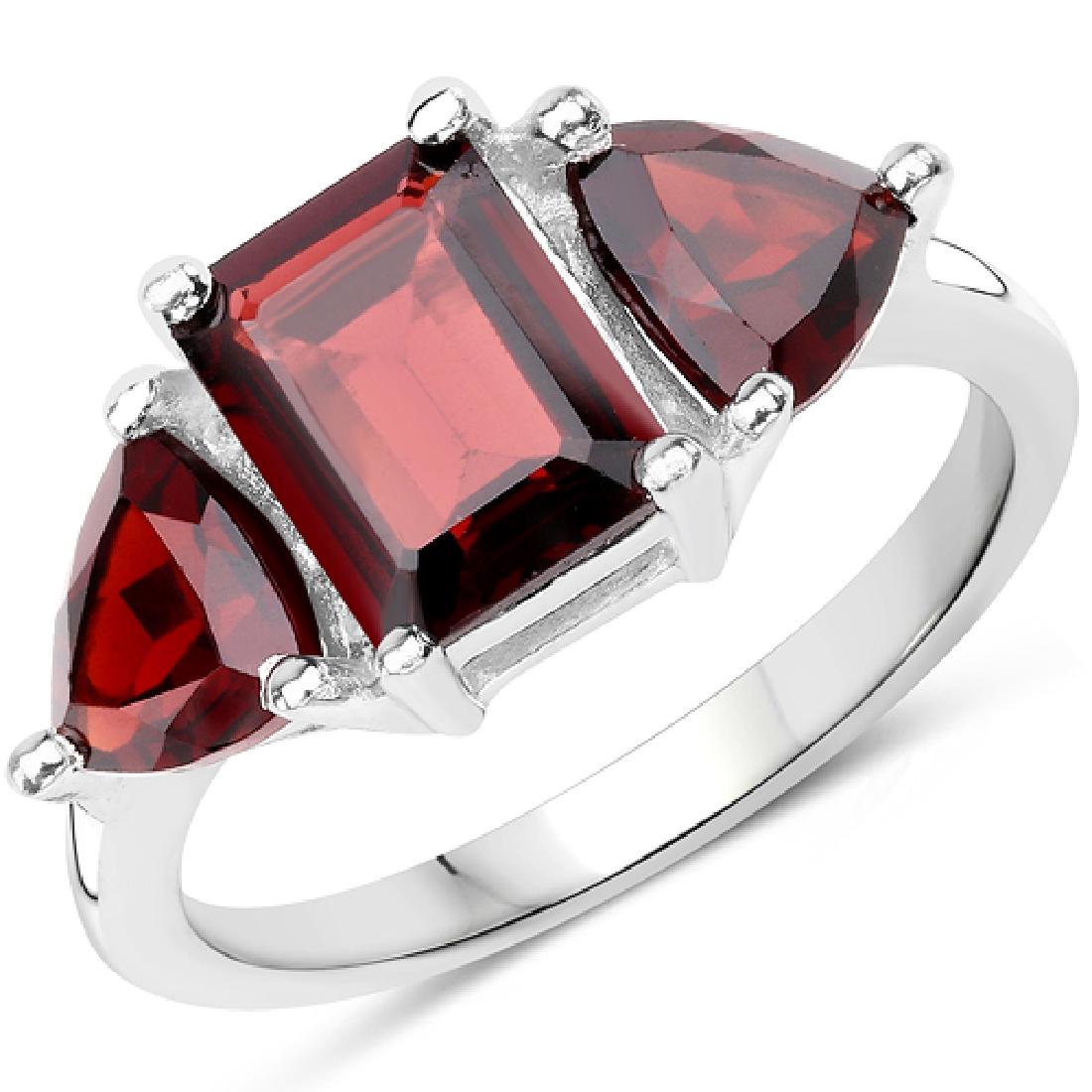 3.45 CTW Genuine Garnet .925 Sterling Silver Ring: 3.45 CTW Genuine Garnet .925 Sterling Silver Ring Metal Type: .925 Sterling Silver Setting: Prong Item: Ring Finish: Rhodium Plated Total CTW: 3.45 Carat Length 8.13 MM Width: 17.02 MM