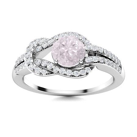 Natural 0.89 CTW Rose Quartz & Diamond Engagement Ring: Natural 0.89 CTW Rose Quartz & Diamond Engagement Ring 14K White Gold Manufacturer's Suggested Retail Price: $2400.00 Center Stone: 1 Rose Quartz @ 0.61 ctw Center Stone Color: Pink Center Stone Clari