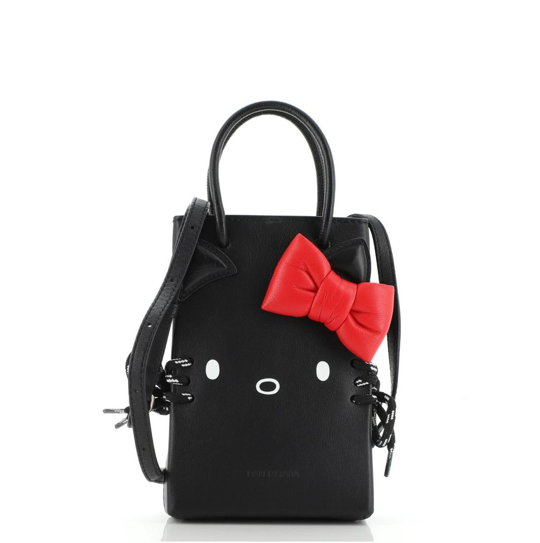 Hello Kitty Shopping Tote Printed Leather Mini: Hello Kitty Shopping Tote Printed Leather Mini Condition: Pre-owned Exterior Color: Black Interior Color: Black Exterior Material: Leather Interior Material: Fabric Hardware Color: Silver