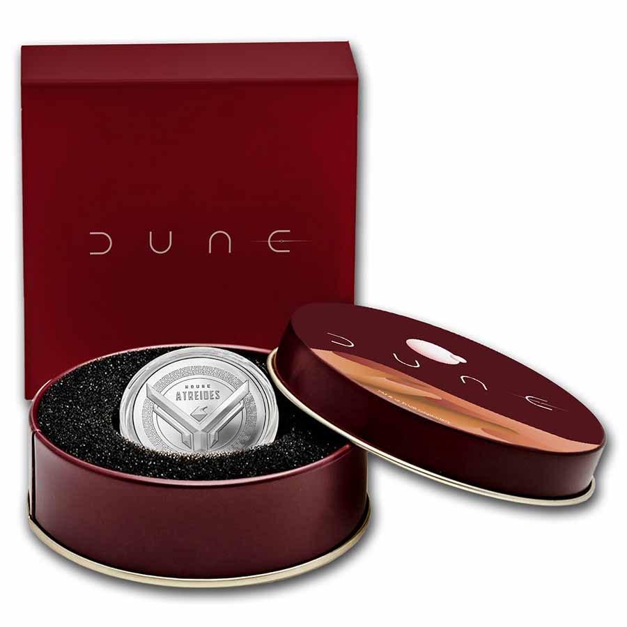 DUNE House Atreides 1 oz Silver w/Gift Box Tin: DUNE House Atreides 1 oz Silver w/Gift Box Tin Product ID: 241317 Year: 2021 Grade: None Grade Service: None Mint Mark: None Metal Content: 1 troy oz Purity: .999 Thickness: 3.2