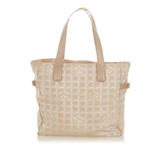 Chanel New Travel Line Canvas Tote Bag: Chanel New Travel Line Canvas Tote Bag Condition Quality: Fair Color: Brown Height: 12 in. Length: 17.5 in. Material: Canvas Width: 4.75 in. Item Condition: Pre Owned SKU: