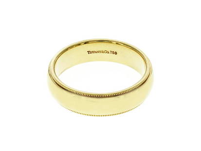 Au Tiffany & Co. 18K Yellow Gold Milgrain 6 Mm Wedding Band Ring: Au Tiffany & Co. 18K Yellow Gold Milgrain 6 Mm Wedding Band Ring SKU: RBJ194425790116-E Brand: Tiffany & Co Condition: Pre-Owned Metal: Yellow Gold Model: 194425790116-E Note: All