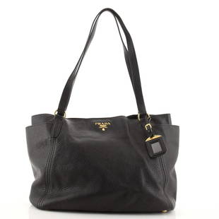 Prada Side Pocket Tote Vitello Daino Medium: Prada Side Pocket Tote Vitello Daino Medium Exterior Color: Black Interior Color: Black Exterior Material: Leather Interior Material: Fabric Hardware Color: Gold Accessories: