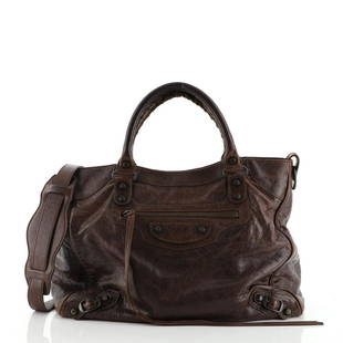 Balenciaga Velo Classic Studs Bag Leather Medium: Balenciaga Velo Classic Studs Bag Leather Medium Exterior Color: Brown Interior Color: Black Exterior Material: Leather Interior Material: Fabric Hardware Color: Antique Brass 