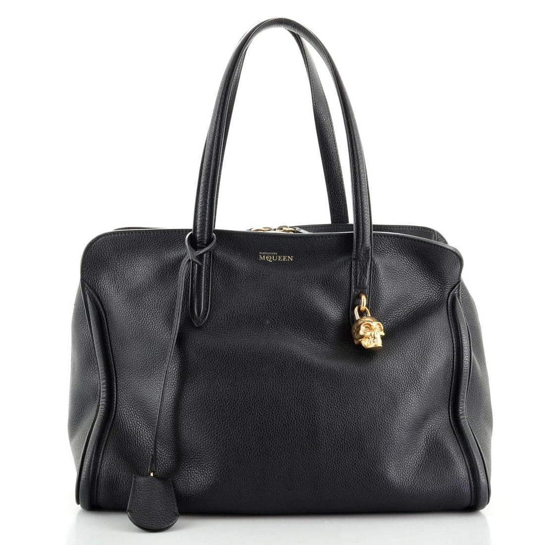 Alexander McQueen Padlock Zip Around Tote Leather Medium: Alexander McQueen Padlock Zip Around Tote Leather Medium Exterior Color: Black Interior Color: Black Exterior Material: Leather Interior Material: Fabric Hardware Color: Gold Accessories: Clochett
