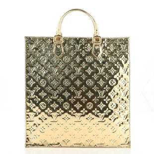 Louis Vuitton Sac Plat Bag Monogram Miroir PVC: Louis Vuitton Sac Plat Bag Monogram Miroir PVC Exterior Color: Gold Interior Color: Neutral Exterior Material: Pvc Interior Material: Fabric Hardware Color: Gold Accessories: Dust