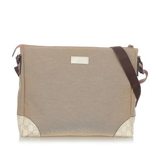 Gucci Canvas Crossbody Bag: Gucci Canvas Crossbody Bag Condition Quality: Fair Color: Brown/White Height: 11 in. Length: 13 in. Material: Calf/Canvas Width: 3 in. Item Condition: Pre Owned SKU: SHG-23152