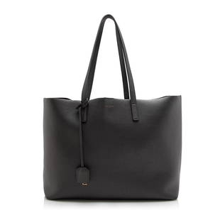 Saint Laurent Calfskin Large Shopping Tote: Saint Laurent Calfskin Large Shopping Tote Condition Quality: Good Color: Grey Height: 11 in. Length: 14 in. Material: Calfskin Width: 5 in. Item Condition: Pre Owned SKU: