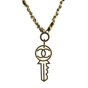 Chanel Key Pendant Necklace Metal with Leather and Crystals: Chanel Key Pendant Necklace Metal with Leather and Crystals Exterior Color: Black, Gold Material: Leather, Metal Ref. no: NL.CH.KEPT.MRAS Item No: 91602/7 Brand Code: B17 A SIZE