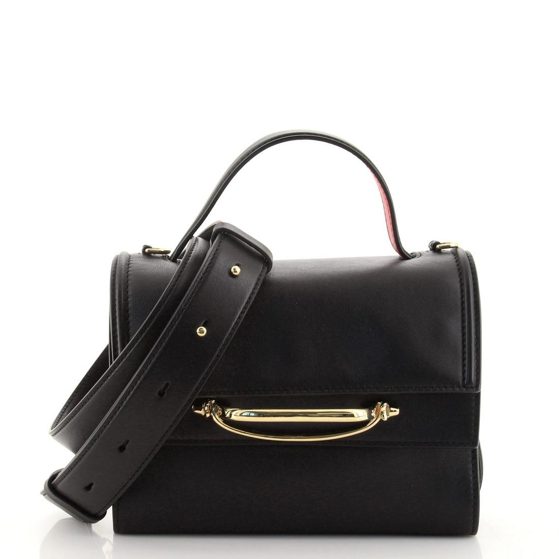 Alexander McQueen The Story Top Handle Bag Leather: Alexander McQueen The Story Top Handle Bag Leather Exterior Color: Black Interior Color: Red Exterior Material: Leather Interior Material: Microfiber Hardware Color: Gold Accessories: Detachable S