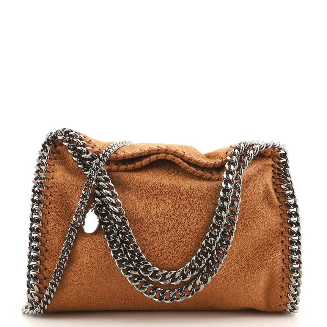 Stella McCartney Falabella Fold Over Crossbody Bag Shaggy Deer Mini: Stella McCartney Falabella Fold Over Crossbody Bag Shaggy Deer Mini Exterior Color: Clear Interior Color: Pink Exterior Material: Fabric Interior Material: Fabric Hardware Color: Gun Metal Accesso