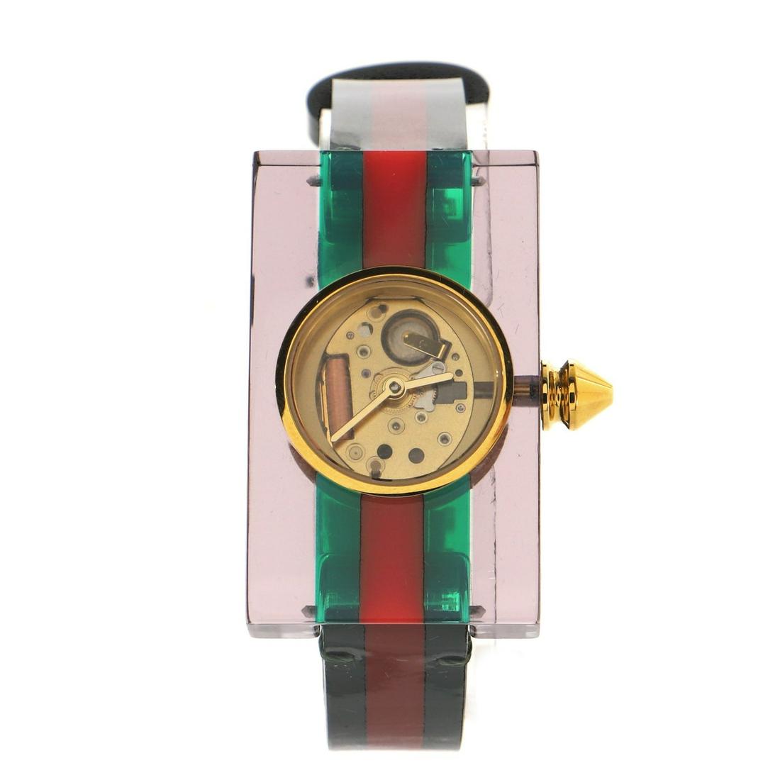 Gucci Vintage Web Rectangular Frame Quartz Watch Plexiglass with Stainless Steel 24: Gucci Vintage Web Rectangular Frame Quartz Watch Plexiglass with Stainless Steel 24 Dial Color: Clear Band Color: Multi Color Band Material: Patent Leather Case Material: Plexiglass Movement: Quartz <