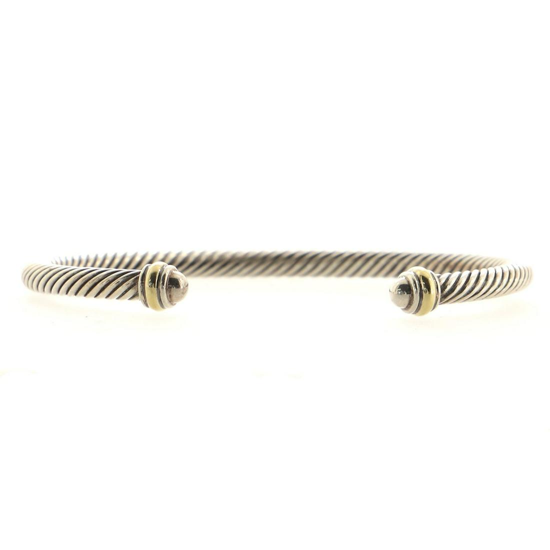 David Yurman Cable Classic Bracelet Sterling Silver and 18K Yellow Gold 4mm: David Yurman Cable Classic Bracelet Sterling Silver and 18K Yellow Gold 4mm Exterior Color: Silver, Yellow Gold Material: 18K Yellow Gold, Sterling Silver RBJ No: BT.DYU.CICS.SIDU.4MM Item No: 96403/4