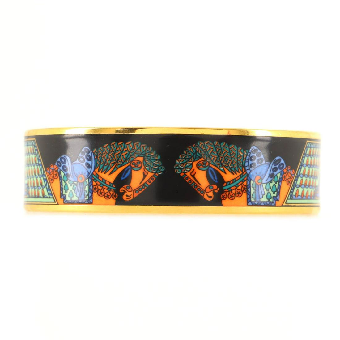 Hermes Bangle Bracelet Printed Enamel Medium: Hermes Bangle Bracelet Printed Enamel Medium Exterior Color: Black, Multicolor Material: Enamel, Metal RBJ no: BT.HM.BAGL.EEEL.ME Item No: 132615/4 SIZE AND FIT: Circumference: 7.75 ", Width: 20