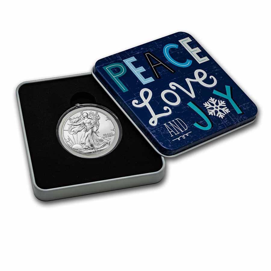 2022 1 oz American Silver Eagle - w/Holiday Tin, Peace Love & Joy: 2022 1 oz American Silver Eagle - w/Holiday Tin, Peace Love & Joy Product ID: 255207 Year: 2022 Grade: Brilliant Unc Grade Service: None Denomination: 1 Dollar Mint Mark: W - West Point (Not Shown