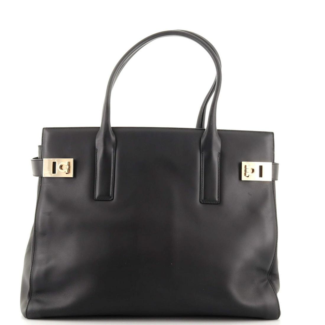 Salvatore Ferragamo Double Gancini Side Buckle Tote Leather Large: Salvatore Ferragamo Double Gancini Side Buckle Tote Leather Large Exterior Color: Black Interior Color: Black Exterior Material: Leather Interior Material: Fabric Hardware Color: Gold Tone Accesso