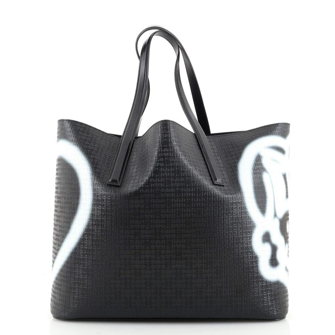Givenchy Wing Shopper Tote Printed 4G Embossed Leather: Givenchy Wing Shopper Tote Printed 4G Embossed Leather Exterior Color: Black Interior Color: Black Exterior Material: Leather Interior Material: Leather Hardware Color: Silver Accessories: Pochett