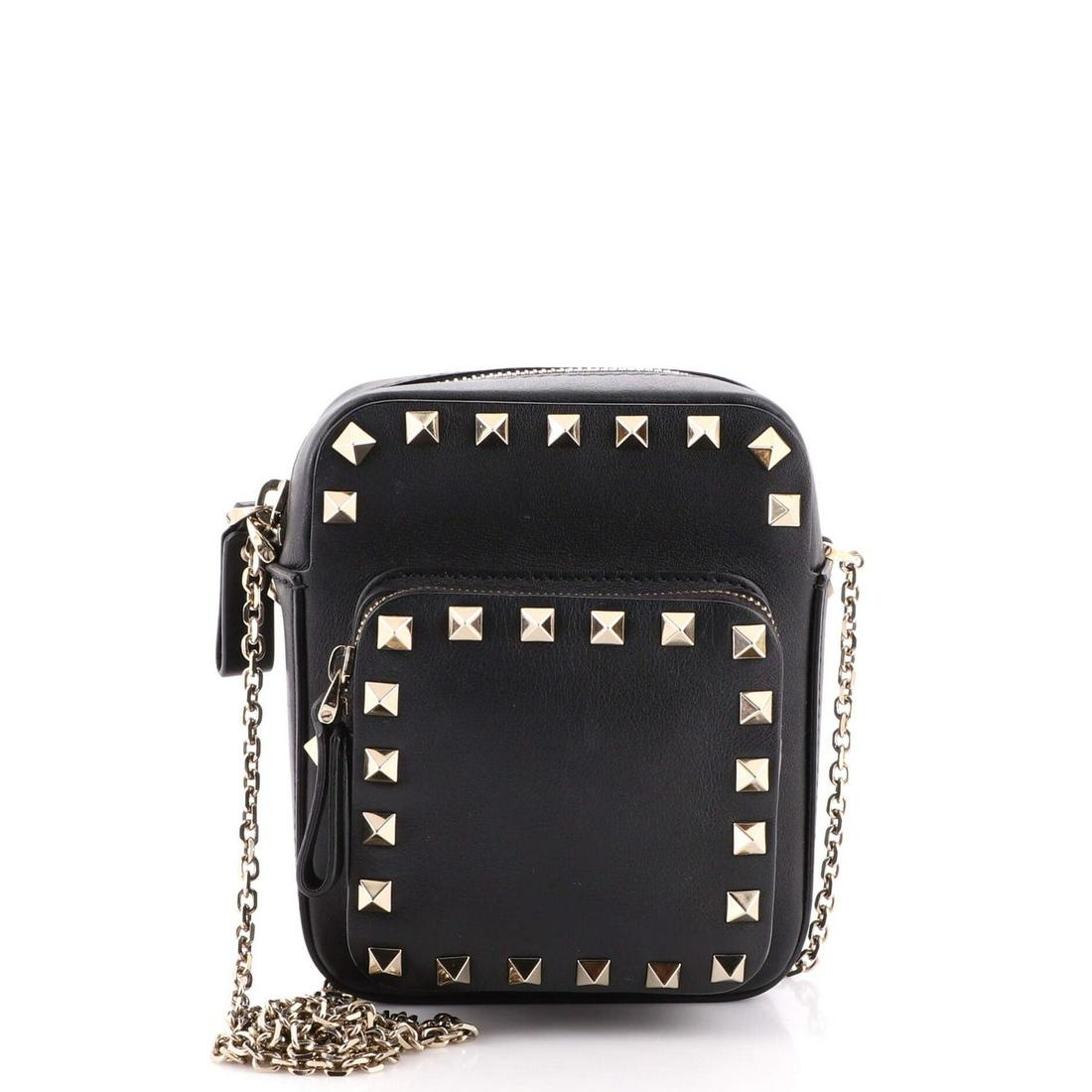 Valentino Garavani Rockstud Pocket Camera Crossbody Bag Leather Small: Valentino Garavani Rockstud Pocket Camera Crossbody Bag Leather Small Exterior Color: Black Interior Color: Black Exterior Material: Leather Interior Material: Leather, Satin Hardware Color: Gold Tone
