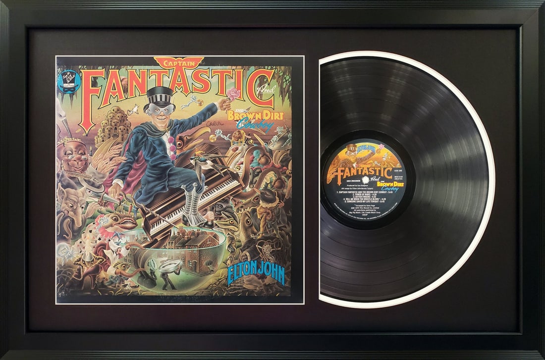elton john "captain fantastic and the brown dirt cowboy" vinyl record & cover professionally framed: elton john "captain fantastic and the brown dirt cowboy" vinyl record & cover professionally framed 17.5? x 26.5? display with a black mat This unique album and cover wall display is professionally an
