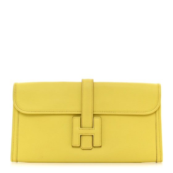 Hermes Epsom Jige Elan 29 Clutch Soufre: Hermes Epsom Jige Elan 29 Clutch Soufre This is an authentic HERMES Epsom Jige Elan 29 Clutch in Soufre. This stylish clutch is crafted of yellow textured calfskin leather in an oversized silhouette.