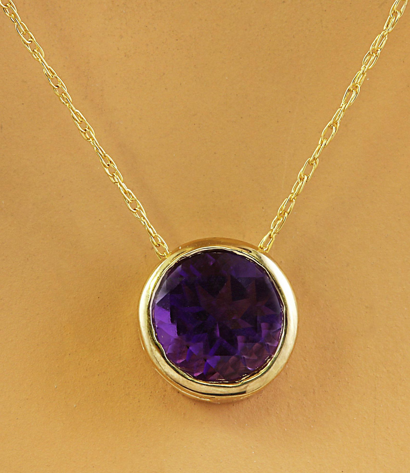 Amethyst Necklace In 14 Karat: Amethyst Necklace In 14 Karat Yellow Gold Metal: 14k Gold, Yellow Gold Stone: Diamond, Amethyst Stone Cut: Round Cut Place of Origin: United States Period: 2010- Date of Manufacture: 2023