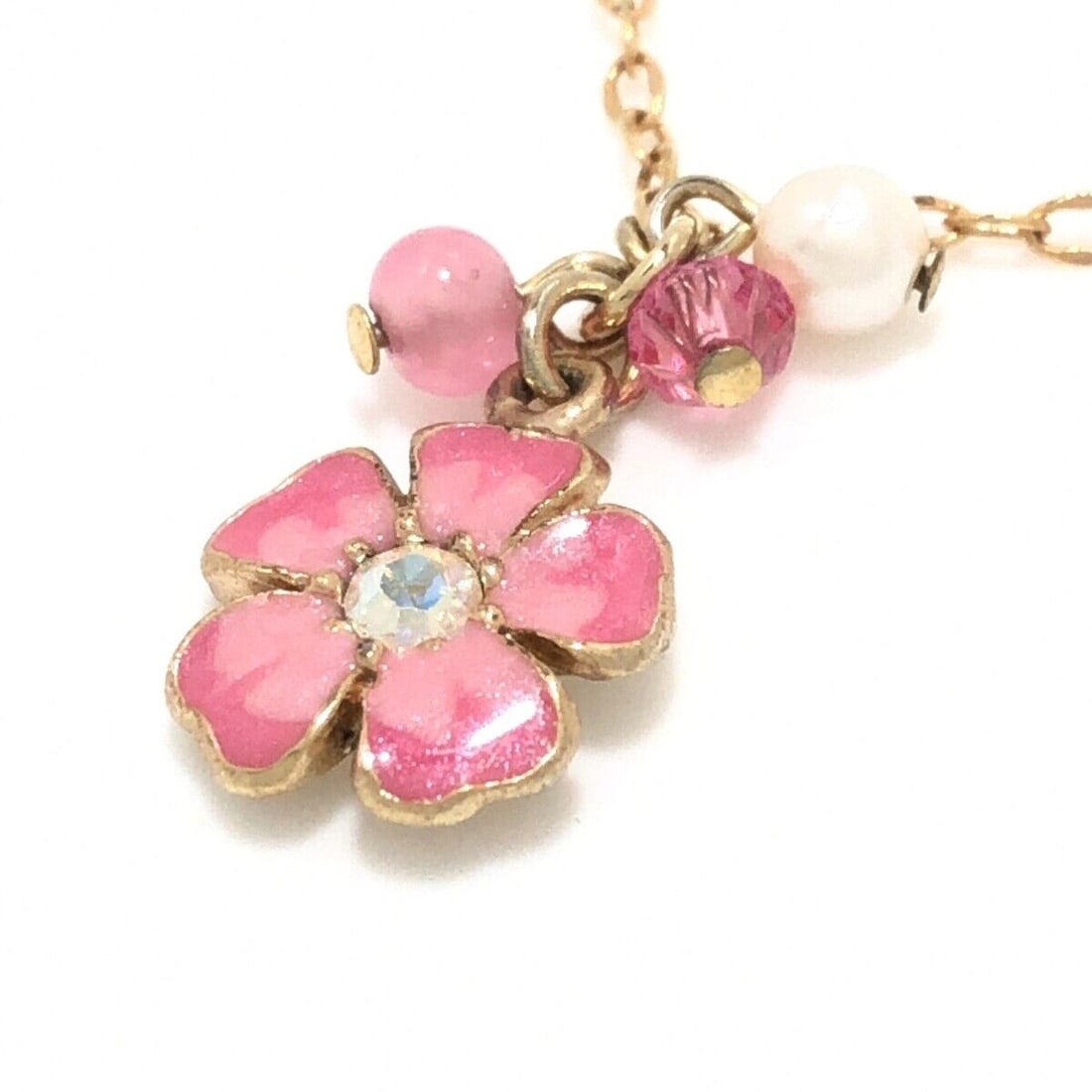 Auth ANNA SUI - Gold Pink: Auth ANNA SUI - Gold Pink White Hardware Rhinestones Fake Pearl Beads Necklace Condition: Pre-owned Brand: ANNA SUI Style: Necklace Color: Gold, Pink, White Material: Hardware, Rhinestones, Fake Pearl