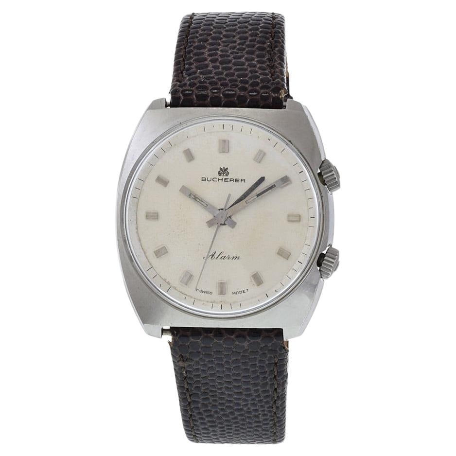 Bucherer Alarm Watch Stainless Steel: Bucherer Alarm Watch Stainless Steel Brand: Bucherer Case Material: Stainless Steel Strap Material: Leather Case Shape: Round Movement: Manual Wind Case Dimensions: Diameter: 1.42 in (36 mm) <