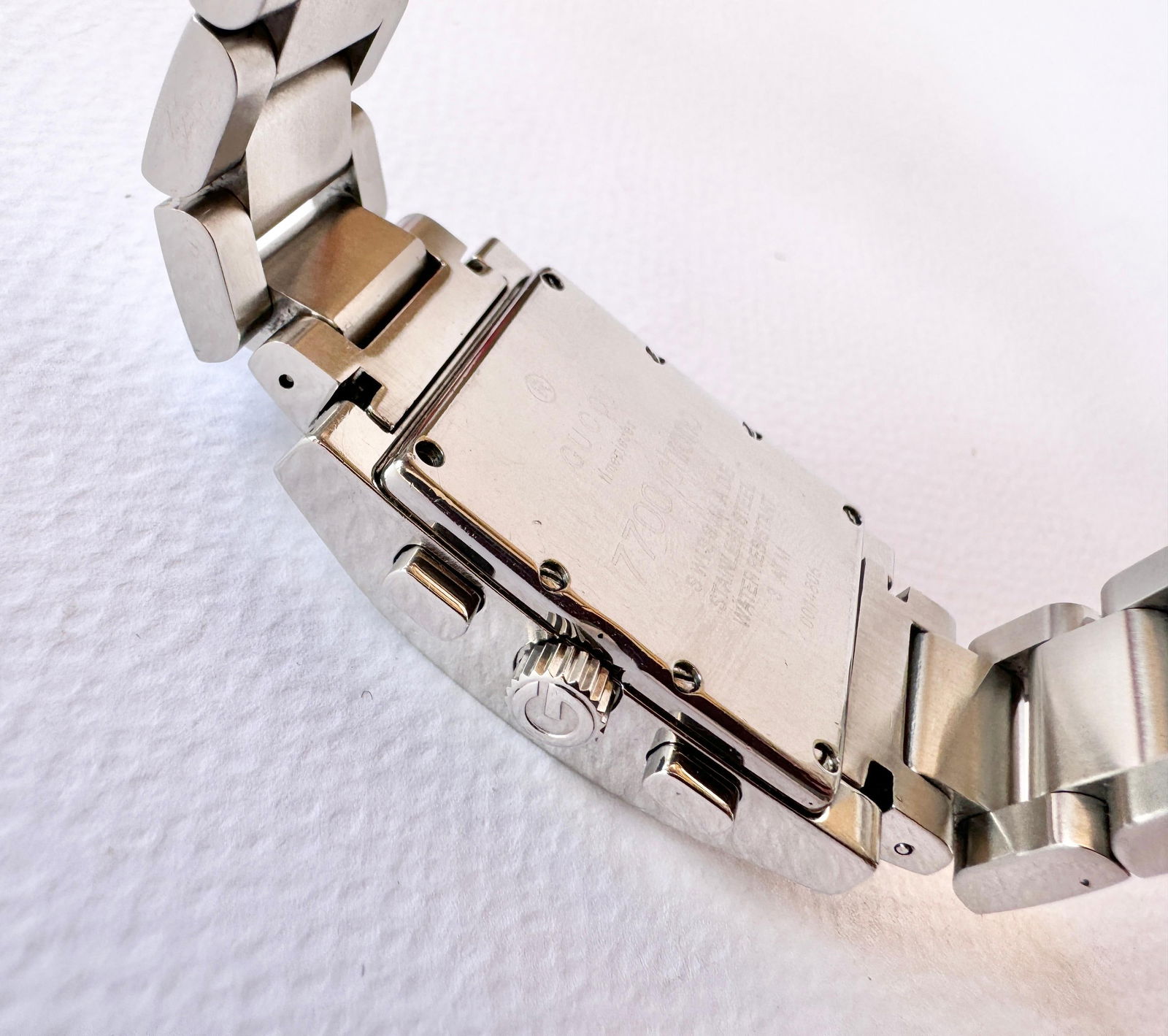 Gucci Chronograph 7700 Stainless-steel Watch: Gucci Chronograph 7700 Stainless-steel Watch Brand: Gucci Case Material: Stainless Steel Strap Material: Stainless Steel Movement: Quartz Chronograph: Yes Place of Origin: Switzerland Per