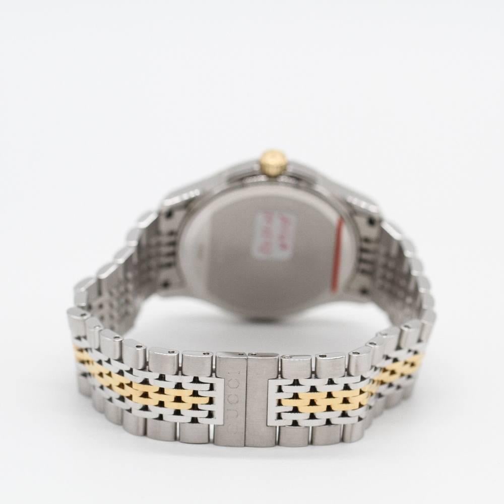 GUCCI G-TIMELESS YA126409 Watch: GUCCI G-TIMELESS YA126409 Watch GUCCI G-TIMELESS Watch YA126409 Brand New Watch, 38mm stainless steel case excluding crown. Case thickness 8.25mm. Sapphire crystal. Silver dial. Gold plated stainless