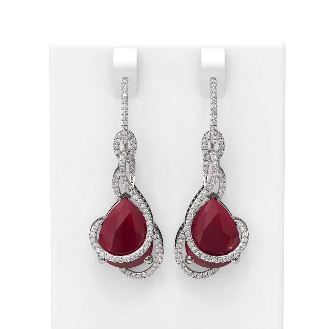 22.9 ctw Ruby & Diamond Earrings 18K White Gold: 22.9 ctw Ruby & Diamond Earrings 18K White Gold Item: Ruby StudTotal Gem weight: 22.9 carats Metal: Solid 18K White Gold Gold Product Weight: Approx. 11.8 grams Jewelry Note: Stud Size is 2/