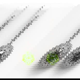 15.02 ctw Tourmaline & Diamond Victorian Earrings 14K White Gold: 15.02 ctw Tourmaline & Diamond Victorian Earrings 14K White Gold Item: Tourmaline EarringTotal Gem weight: 15.02 carats Metal: Solid 14K White Gold Gold Product Weight: Approx. 14.5 grams Jewelr
