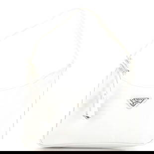 Prada Re-Edition 2000 Hobo Tessuto Mini: Prada Re-Edition 2000 Hobo Tessuto Mini Exterior Color: White Interior Color: White Exterior Material: Nylon Interior Material: Fabric Hardware Color: Silver Estimated Retail:
