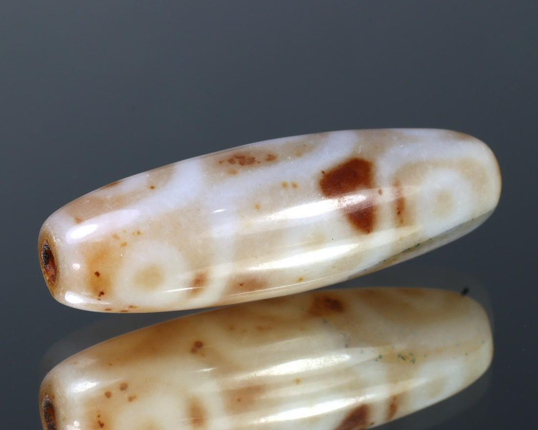 Tibetan Agate Dzi Bead Etched 10g 4x1.3cm: Thousand Planet Auction House Treasure Auction Day, all major kinds of Mineral, you will find in today's auctions. Join us and add our auction into your calendar. Today auction including Artifacts, Mi