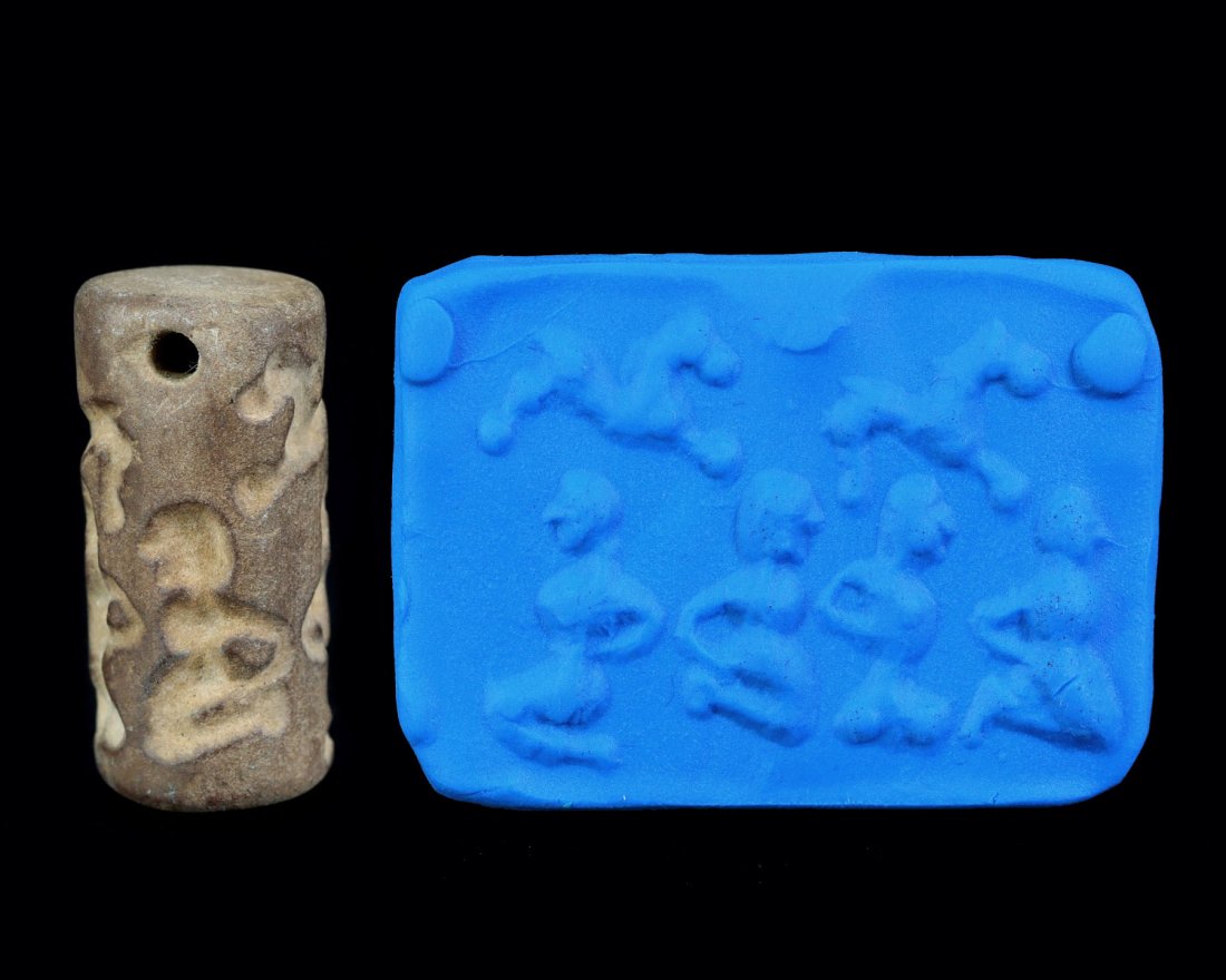 A Neo-Assyrian Mesopotamian Steatite Cylinder Seal: A Neo-Assyrian Mesopotamian Steatite Cylinder Seal Cultures/Periods: Circa 8th-7th B.C. Dimension: 33x14mm Findspot: Syria Provenance: Private Collection, Iranian, acquired before year 2017