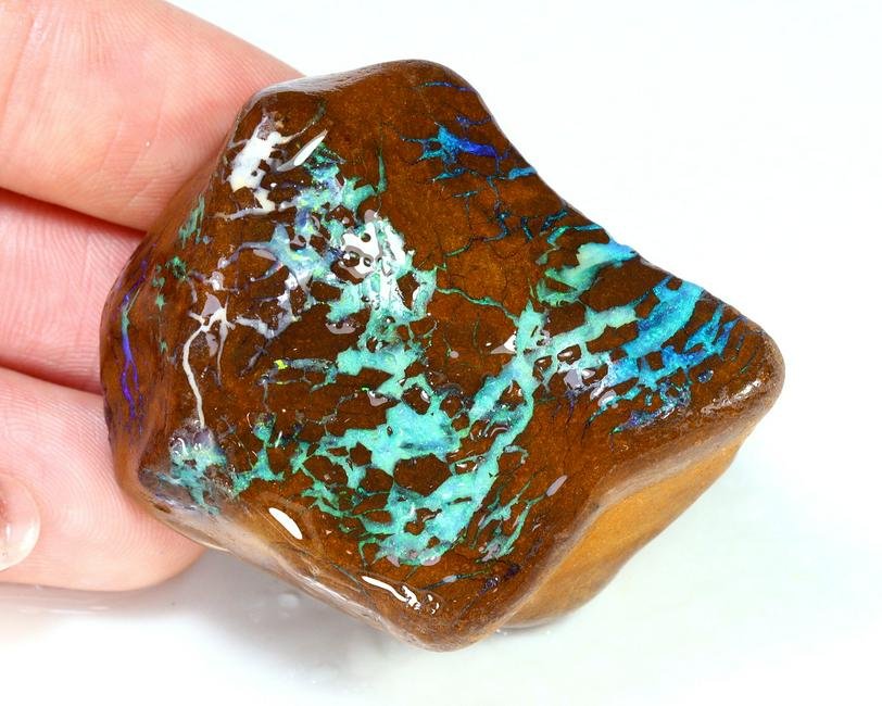 Australian Queensland Winton Mine Purple Blue Boulder Opal Rough: Australian Queensland Winton Mine Purple Blue Boulder Opal Rough Opal Condition: Rough (Photos taken in wet) Origin: Winton Opal Mine Purpose: For display or cutting use Purity: No treatment Manufactu
