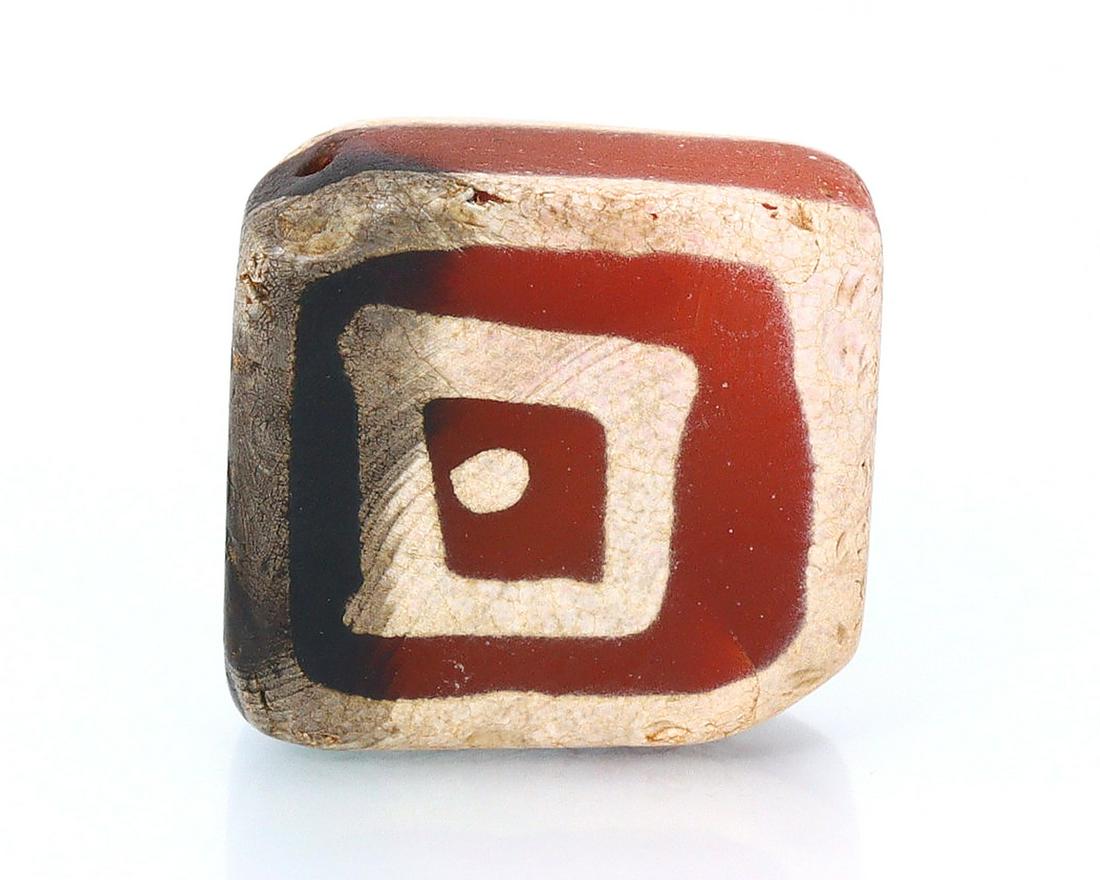 An Antique Western Asiatic Decorated Tabular Shaped Diamond Eye Carnelian dZi Bead: Dimension: 12.9x12.3x5.4mm New - Produced within the last 20 years Vintage - Over 20 years of age but less than 100 years of age Antique - Over 100 years of age but less than 500 years of age Ancient 