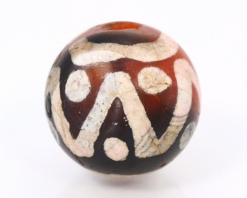 An Antique Western Asiatic Round Shaped Etched Carnelian Horse Tooth Tasso dZi Bead: Dimension: 11.5x11.5mm New - Produced within the last 20 years Vintage - Over 20 years of age but less than 100 years of age Antique - Over 100 years of age but less than 500 years of age Ancient - Ov