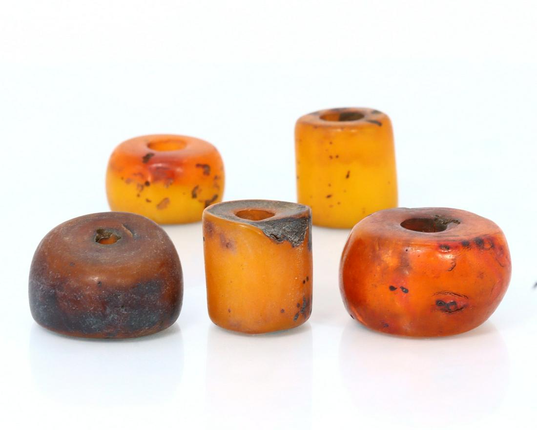 Five Vintage or Antique Tibetan Orange Amber Resin Mala Beads: Dimension: 22x21.2x12.6mm New - Produced within the last 20 years Vintage - Over 20 years of age but less than 100 years of age Antique - Over 100 years of age but less than 500 years of age Ancient -