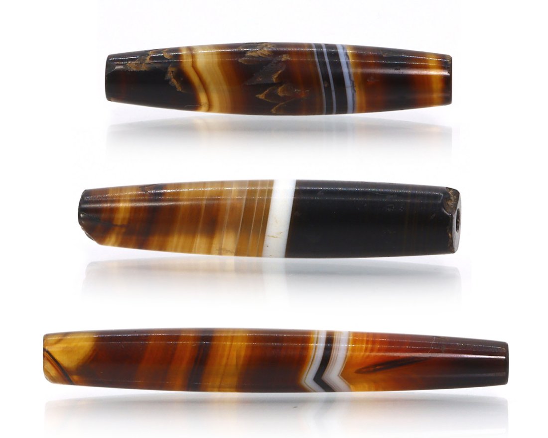 Three Antique Tibetan Pyu Banded Agate Chung dZi Beads Asian Art Carving Antique: Dimension: 51x7.3mm Thousand Planet Auction House Season 2 Asian Treasure Hunt Auction, auction including Abstract Oil Painting, Sculptures & Carvings, Statues & Statuettes, Bust Carving, Signet Rings