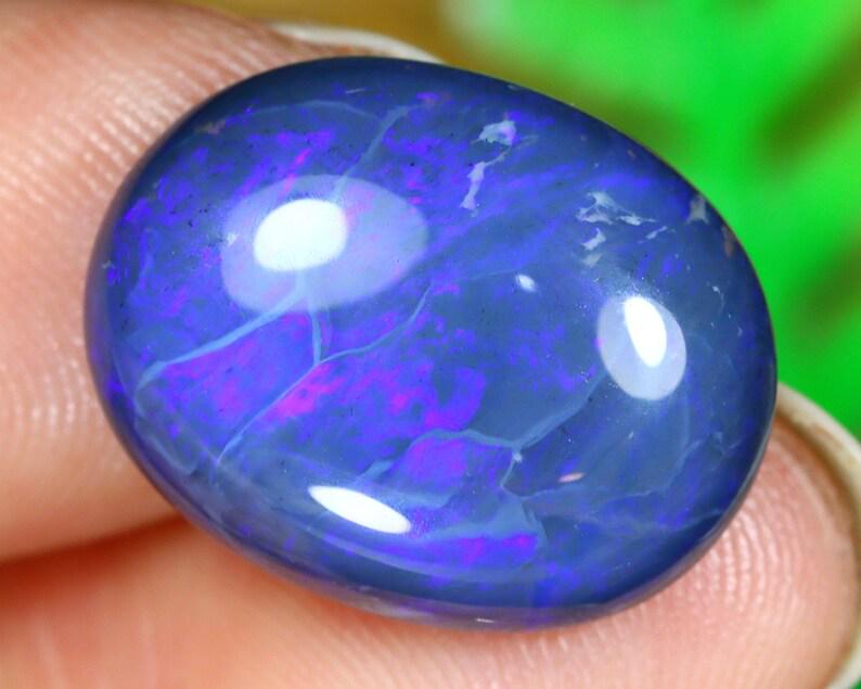 Australian Lightning Ridge Mine Loose Black Opal Dark Solid Opal Cabochon: Dimension: 15.8x12.4x5.7mm Thousand Planet Auction House Season 2 Asian Treasure Hunt Auction, auction including Abstract Oil Painting, Sculptures & Carvings, Statues & Statuettes, Bust Carving, Signe