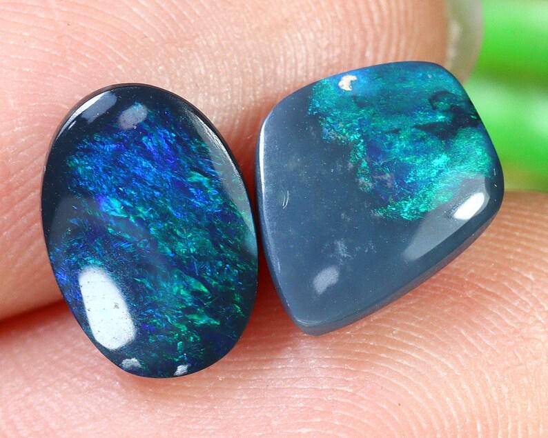 Australian Lightning Ridge Mine Loose Black Opal Dark Solid Opal Cabochon: Dimension: 9.7x7.6x3.4mm Thousand Planet Auction House Season 2 Asian Treasure Hunt Auction, auction including Abstract Oil Painting, Sculptures & Carvings, Statues & Statuettes, Bust Carving, Signet