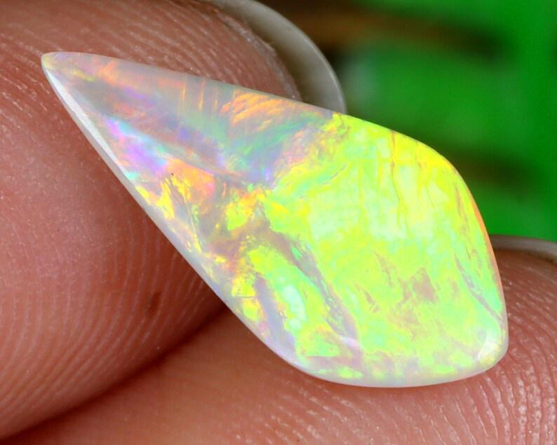 Australian Lightning Ridge Mine Loose Black Opal Dark Solid Opal Cabochon: Dimension: 15x7.3x1.9mm Thousand Planet Auction House Season 2 Asian Treasure Hunt Auction, auction including Abstract Oil Painting, Sculptures & Carvings, Statues & Statuettes, Bust Carving, Signet R