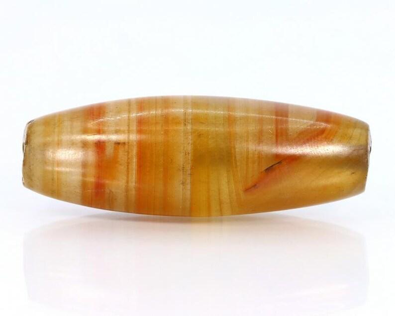 75Ct Himalayan Tibetan Natural Multi Stripes Chung dZi Bead: Dimension: 43.3x15.6mm Natural History of Australian Opal & Mineral Auction by Thousand Planet Auction House featuring the beauty of Boulder Opal art in cabochon cutting and rough, well known Australi