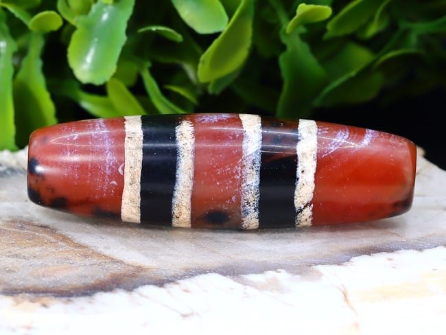 Antique Vintage Old Tibetan Pyu Striped Agate Carnelian Bead: 14x48mm Weight: 78 carat (Before Packing) Thousand Planet Auction House Season 5: Ten2Go Antique Beads Collection Auction. A bargain hunter's, fixer-upper's, and pack-rat's dream come true! Our Ten2Go