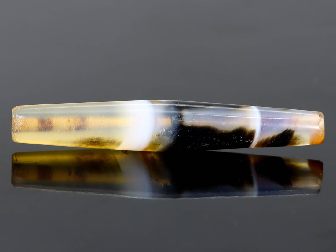 Antique Vintage Old Tibetan Bicone Pyu Striped Agate Bead: 51.6x8.4mm Weight: 26.3 carat (Before Packing) Thousand Planet Auction House Season 5: Ten2Go Antique Beads Collection Auction. A bargain hunter's, fixer-upper's, and pack-rat's dream come true! Our T