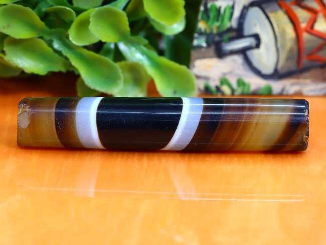Antique Vintage Old Tibetan Pyu Striped Agate Bead: 53.8x9.5mm Weight: 46.5 carat (Before Packing) Thousand Planet Auction House Season 5: Ten2Go Antique Beads Collection Auction. A bargain hunter's, fixer-upper's, and pack-rat's dream come true! Our T