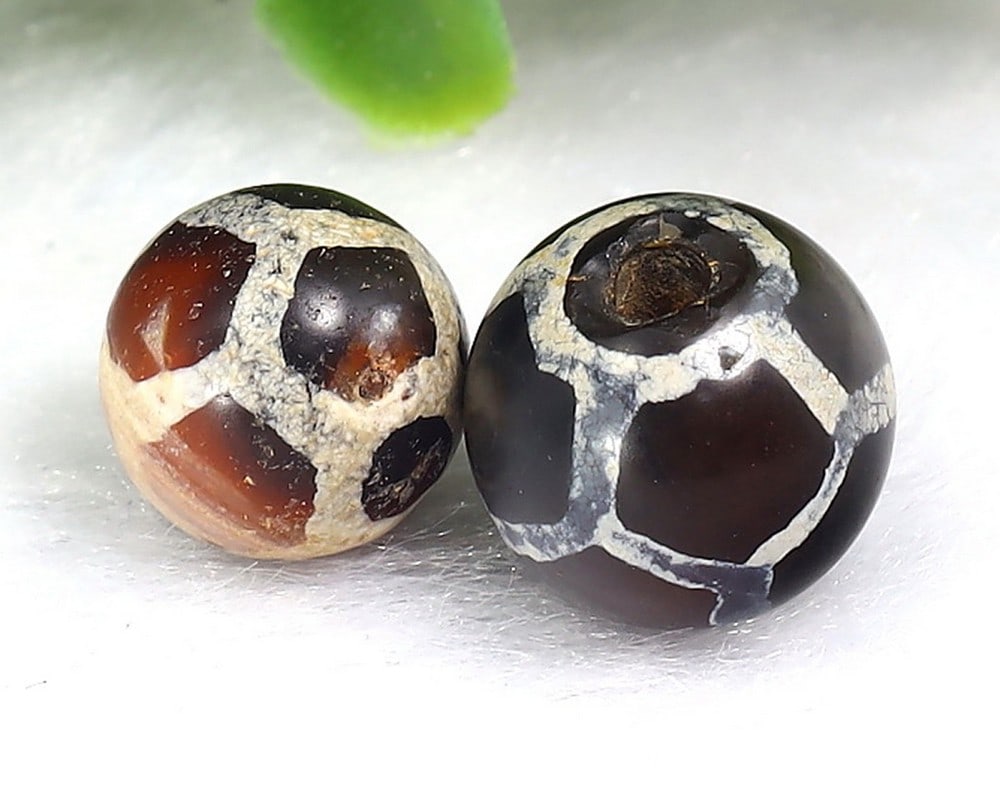 Two Antique Vintage Indo Tibetan Etched Agate dZi Beads: 10.5x10.4mm Weight: 12.5 carat (Before Packing) Thousand Planet Auction House Season 5: Ten2Go Antique Beads Collection Auction. A bargain hunter's, fixer-upper's, and pack-rat's dream come true! Our