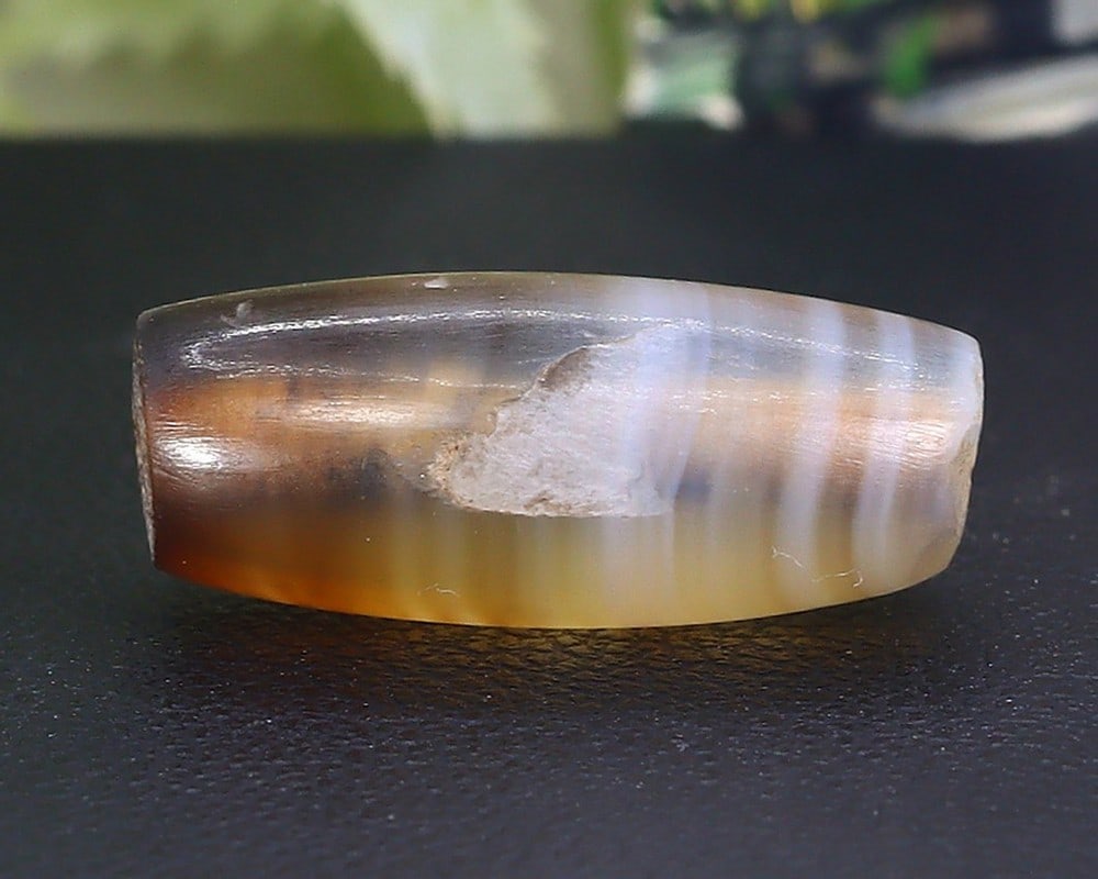 Antique Vintage Old Tibetan Pyu Striped Agate Bead: 18x7.7mm Weight: 8.5 carat (Before Packing) Thousand Planet Auction House Season 5: Ten2Go Antique Beads Collection Auction. A bargain hunter's, fixer-upper's, and pack-rat's dream come true! Our Ten2