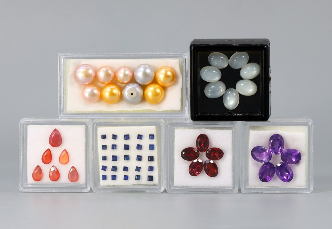 52.33Ct of Natural Pearl, Moonstone, Amethyst, Garnet & Sapphire: Size Range 8.1mmx6.0mm - 2.1mmx1.3mm Total Gems Weight: 52.33 carats (Before Packing) A bargain hunter's, fixer-upper's, and pack-rat's dream come true! Our Ten2Go "warehouse" style auction presents o