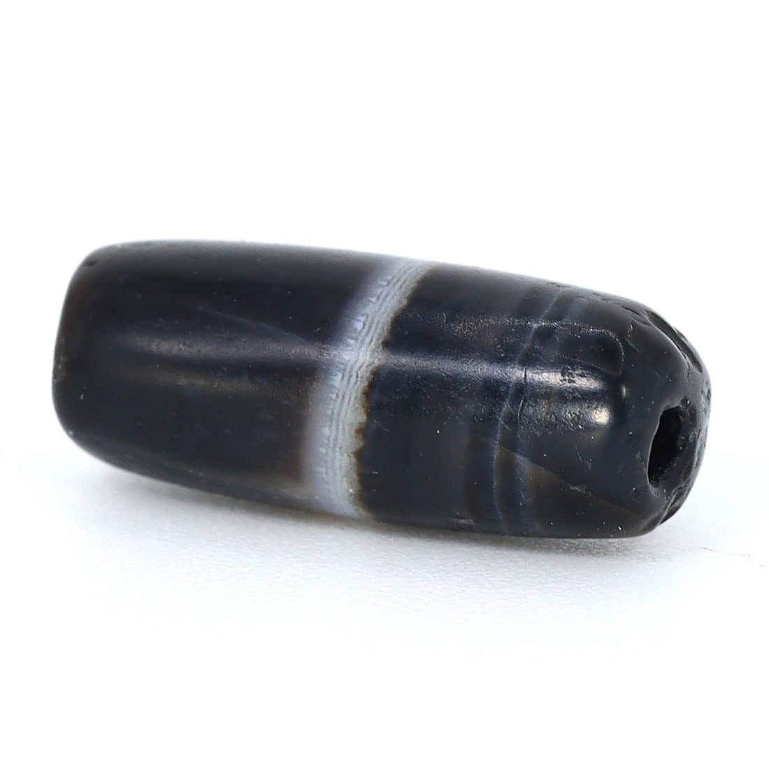 Ancient Persian Banded Agate Dzi Bead, Parthian Period (3rdC BC - 1stC BC): Dimension: 13x5.3mm "Journey Through Time: Ancient Bronze Age Beads, Sculpture, and Ornaments, Featuring Himalayan Tibetan Agate Carnelian Dzi Beads" Unearth the timeless allure of ancient beads, scul